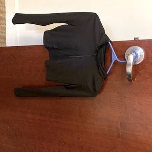 Tight fitted, zip up, long sleeve shirt